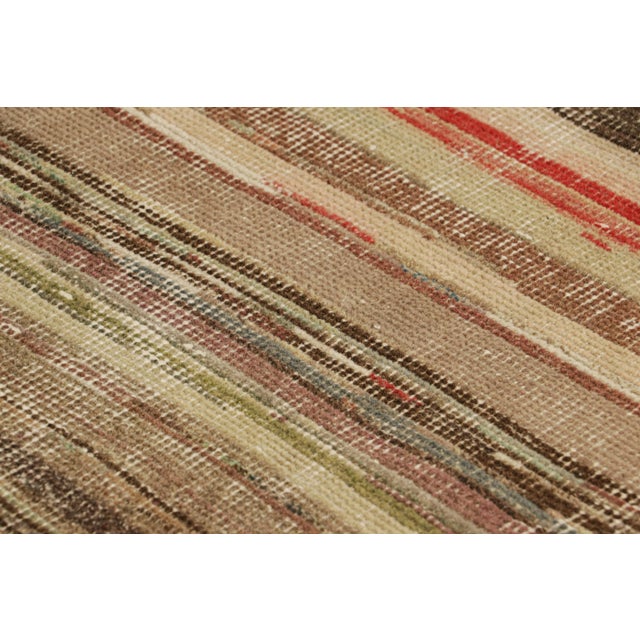 Hand-knotted in wool and originating from Turkey circa 1960 – 1970, this 3x3 vintage Zeki Müren rug is a unique addition...