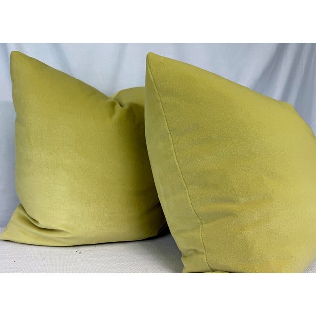 Custom pair of 22" pillows covered in a lemon yellow cotton blend velvet. These pillows have tapered corners to prevent...
