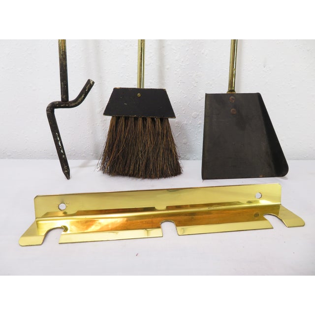 Excellent mid century modern brass wall mounted fireplace tools. I took these off the wall of a clean well kept mid...