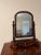 Antique dresser or vanity mirror. The base is covered in a flame mahogany veneer, with no missing pieces. The posts are...