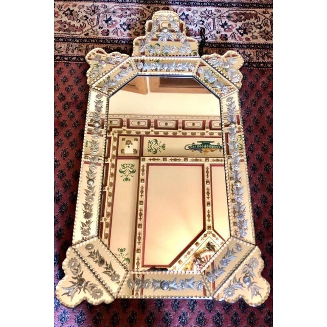 A magnificent Murano crystal mirror with cut glass and embellishments from the 1920s. The beveled mirror frame features...