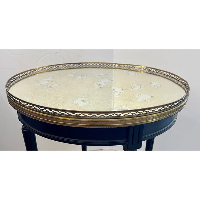 Just imagine, This French Louis XVI style Bouillotte Table, with a perforated Brass Gallery and antiqued Mirrored Top....