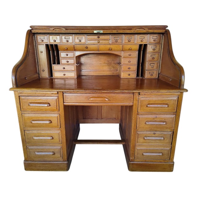 Impressive restored 1890s English roll-top desk in excellent condition for its age. This beautiful antique features a...