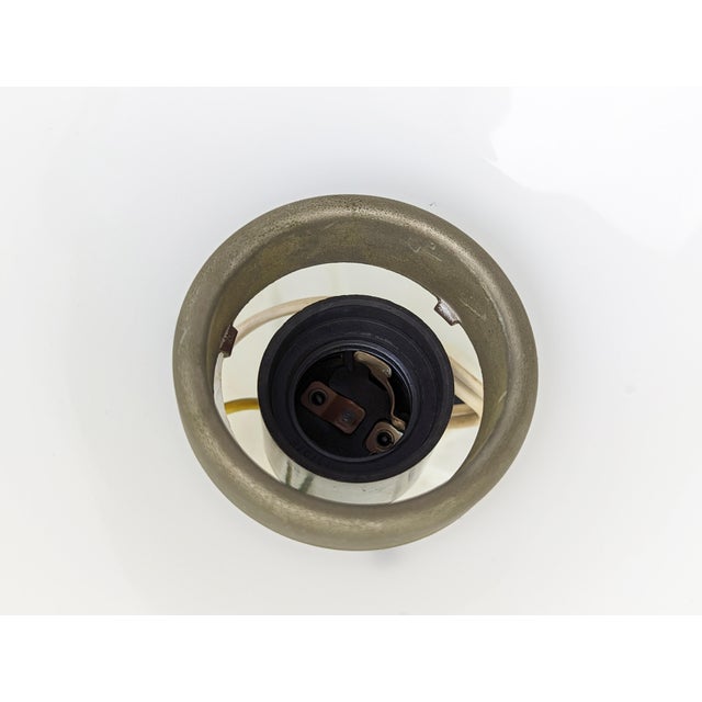 This Velella lamp can be used as sconce or as a ceiling lamp. It is made from a painted metal frame with adjustable...