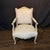 Stunning pair of 19th century French Louis XV bergères with carved painted frames, serpentine crest rails, scrolling arms,...