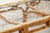 A bed made of Italian bamboo from the 1960s, 90 cm wide. The headboard is taller than the footboard, and it features an...
