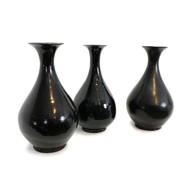 Vintage style black ceramic flute vase. Attractive hand thrown and glazed pottery. Each is slightly unique in finish...