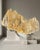 A substantial natural Himalayan Golden Feldspar matrix specimen selected for its stratified architectural form, warm...