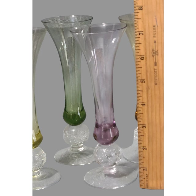 Enhance your drinkware collection with this set of four colorful cordial glasses. The ice ball base design adds a touch of...