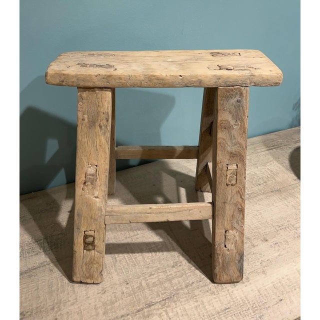 This petite vintage step stool was once a humble household tool, now reimagined as a charming accent piece. Its compact...