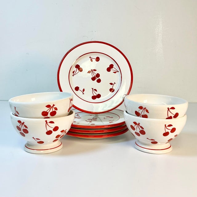 We fell in love with this vintage set immediately. It has a 1930s Art Deco vibe with bright red cherries on a white...