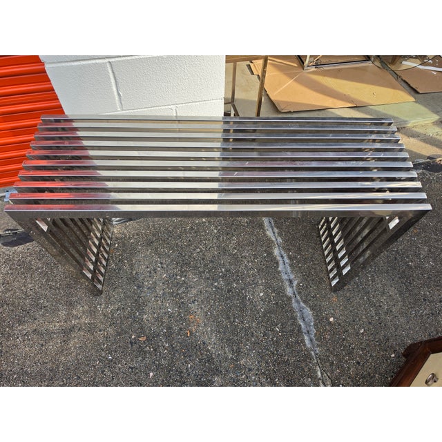 Beautiful vintage Mid-Century Modern chrome slat console table/bench in the style of Milo Baughman, featuring a striking...