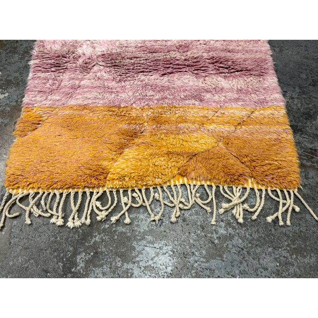 Design Plus Gallery presents a 4ft2in x 5ft10in Beni Mrirt Shag Area Rug. Bubbling with youthful personality based in...