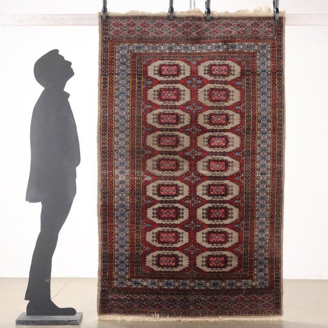 Bukhara rug in cotton and wool, fine knot, manual production. This piece is attributed to the mentioned designer/maker. It...