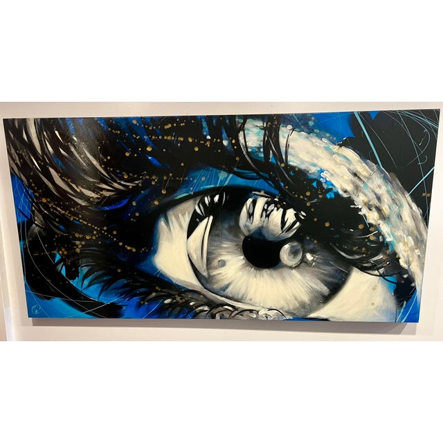 Original artwork by Miami-born artist, Cynthia Coulombe-Bégin, depicting a close-up of a human eye. The piece was...