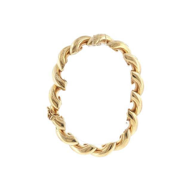 A late-20th-century 14k gold macaroni-link bracelet from Italy. Weighs 23.8 grams. Measures 7.0 inches long and 11.5 mm...