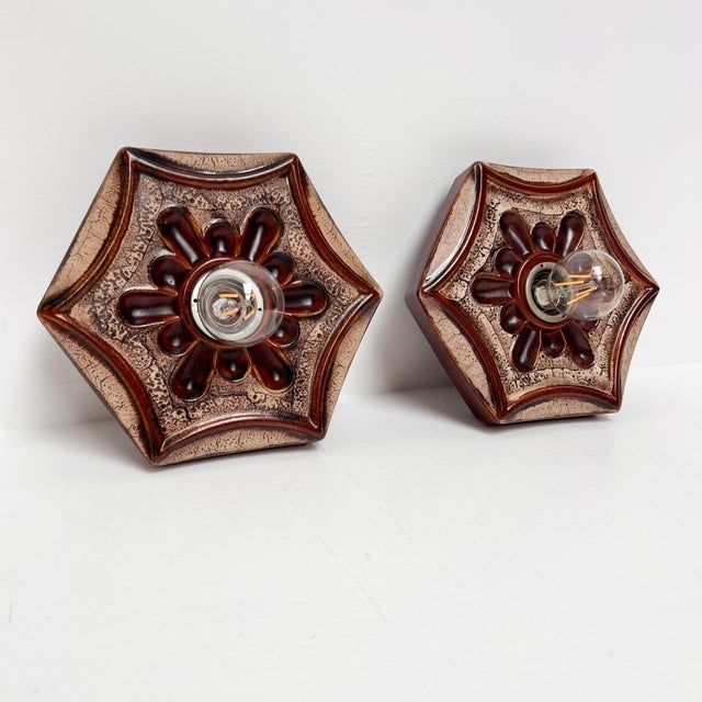 Beautiful set of 2 ceramic wall lamps in warm brown and beige colors. Produced by Hustadt in Germany in the 1970s. The...