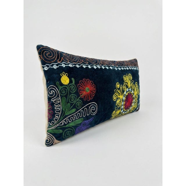 This beautiful 11'' x 20'' hand-embroidered Suzani pillow cover was made from authentic Uzbek cotton fabric. The intricate...