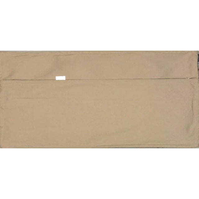 This pillow is made with a vintage handwoven Turkish kilim rug fragment. It has a cotton back and a zipper closure. Please...