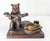 We are selling this 20th century German Black Forest carving. This carving features a bear holding a shelf with five holes...