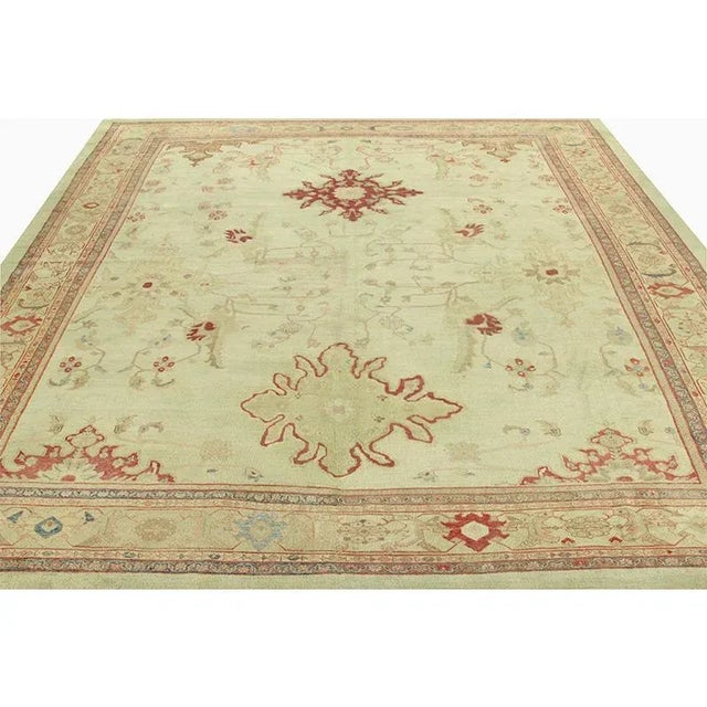 ACTUAL SIZE: 13’0″ x 14’10” PRIMARY COLOR: Light Green AGE: Antique MATERIALS: Wool FOUNDATION: Cotton PRODUCTION:...