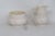 This lovely Creamer and Sugar Bowl set is made out of porcelain. This set is stamped as being made by Belleek in Ireland,...