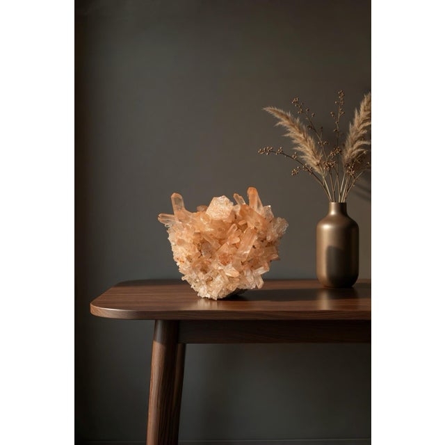 A small sculptural natural Tangerine Quartz cluster selected for its warm rust-orange hematite coating, translucent quartz...
