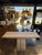 Elegant console table crafted in Italy from natural travertine stone. Table features a striking rectangular top with clean...