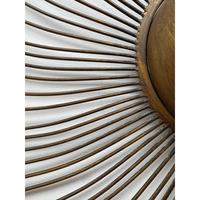 Great vintage starburst wall sculpture with a warm aged brass finish and loads of presence. The piece is quite substantial...