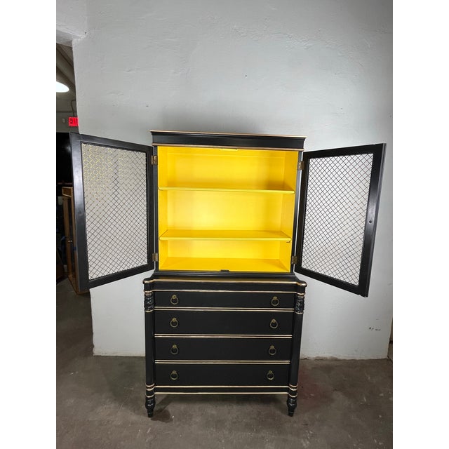 Fantastic vintage painted Regency Cabinet. Beautiful painted cabinet with glamorous wire mesh doors. Painted a rich black...