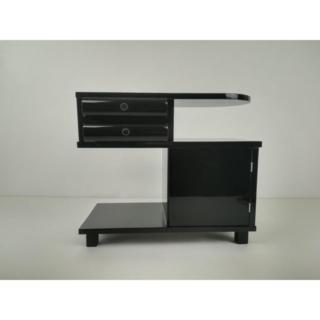 Beautiful Art Deco bedside table from around 1920. This elegant Austrian piece has been meticulously restored by hand and...