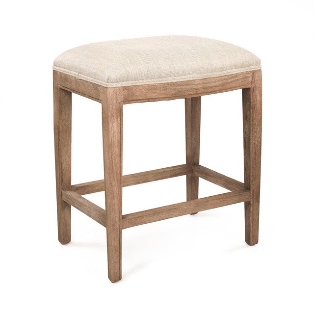 The Cora Counter Stool from Zentique in oatmeal linen offers the same clean-lined backless silhouette without nailhead...