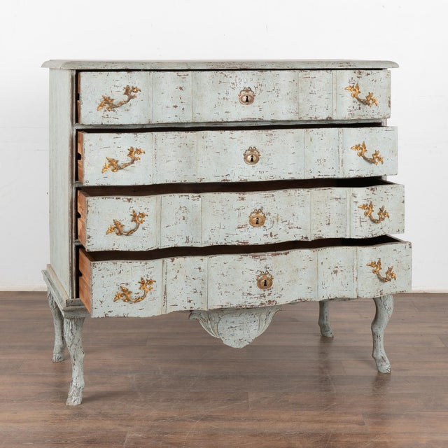 Large antique oak chest of four drawers with handsome brass hardware pulls all raised on attractive carved legs (notice...