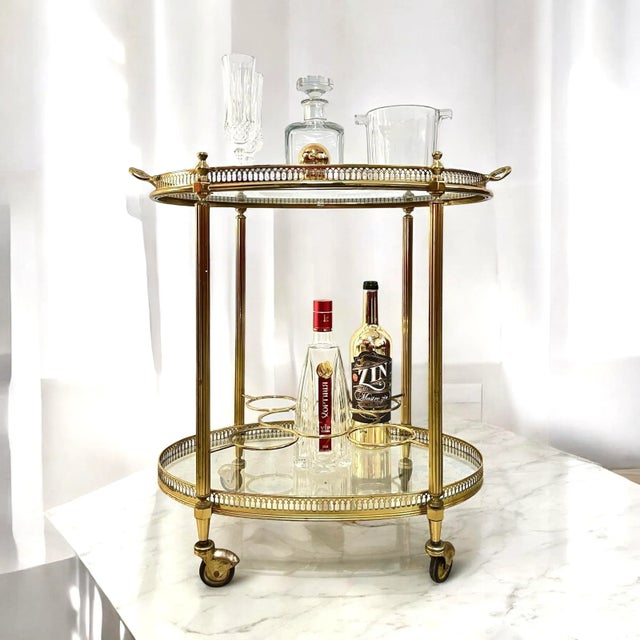 Vintage brass bar cart in the style of maison baguès | france, c. Mid-20th century elegant vintage bar cart in the style...
