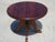 Coffee table, 70 cm in diameter, made of cherry wood. Tabletop 38 mm thick. Central four-legged base with curved edges for...