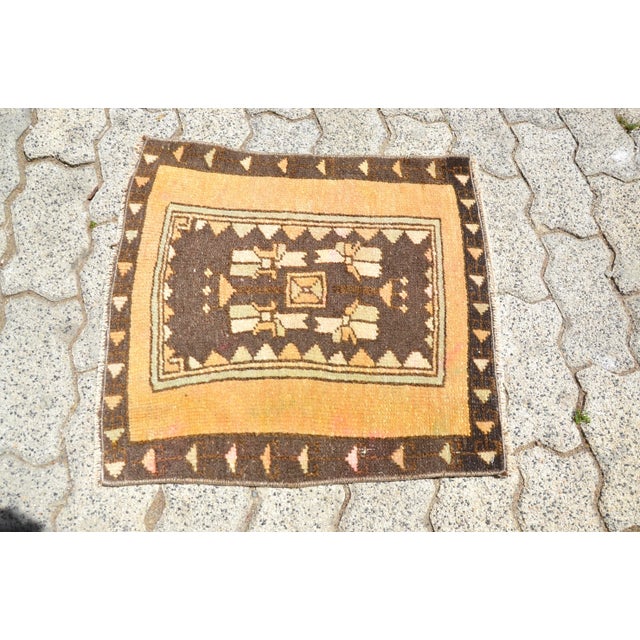 This is a vintage Turkish Oushak rug from the 1960s. The piece was hand-knotted.