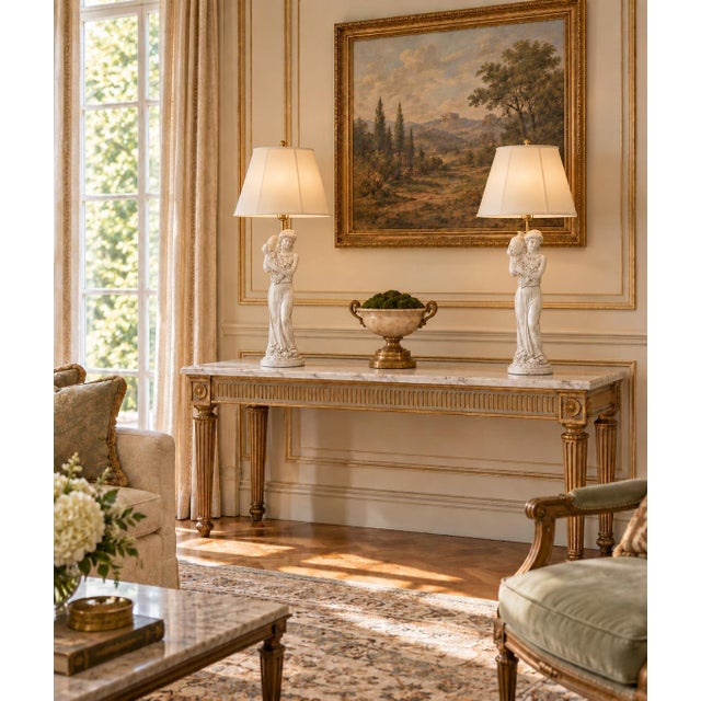 Bring the romance of classical Europe into your home with this elegant pair of Neoclassical figural table lamps inspired...