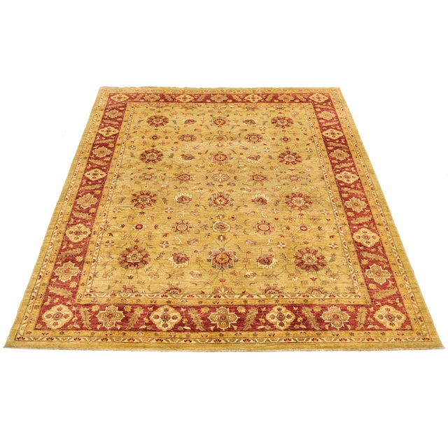 Modern Pakistani Peshawar Rug – Hand-knotted in wool, this refined piece features a muted gold field with vertical rows of...
