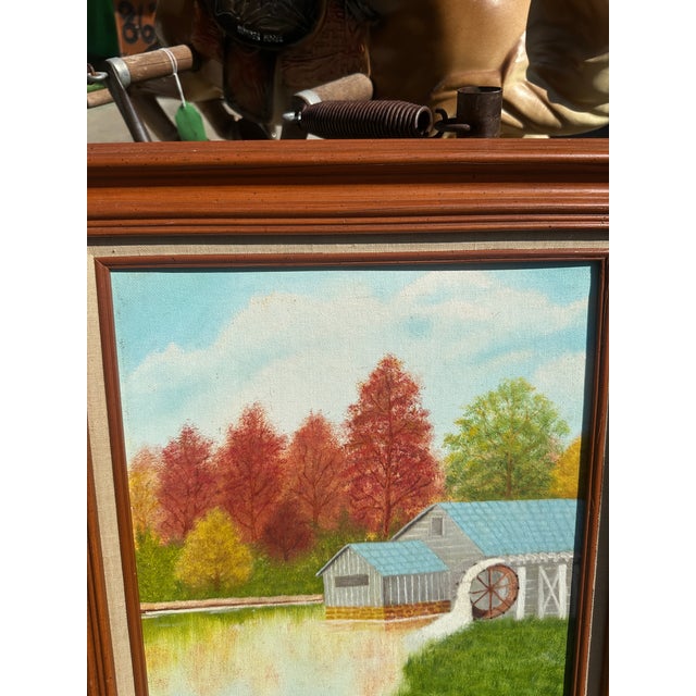 Up for consideration is a beautiful vintage watermill and colorful foliage landscape painting on canvas, signed by the...
