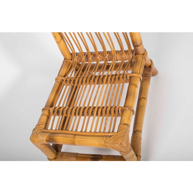 An elegant mid-20th-century chair crafted from rattan and natural bamboo by Audoux-Minet, a French firm renowned for its...