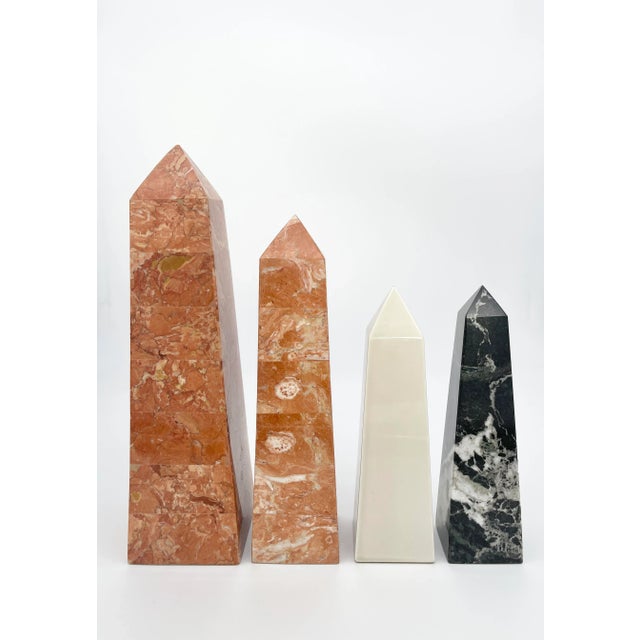Striking set of four obelisks. Pair of (Italian) hollow orange veined marble, one (Italian) black solid marble, one white...