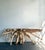 This monumental console table is a breathtaking marriage of raw nature and refined artisanal craft. Hewn from a massive,...