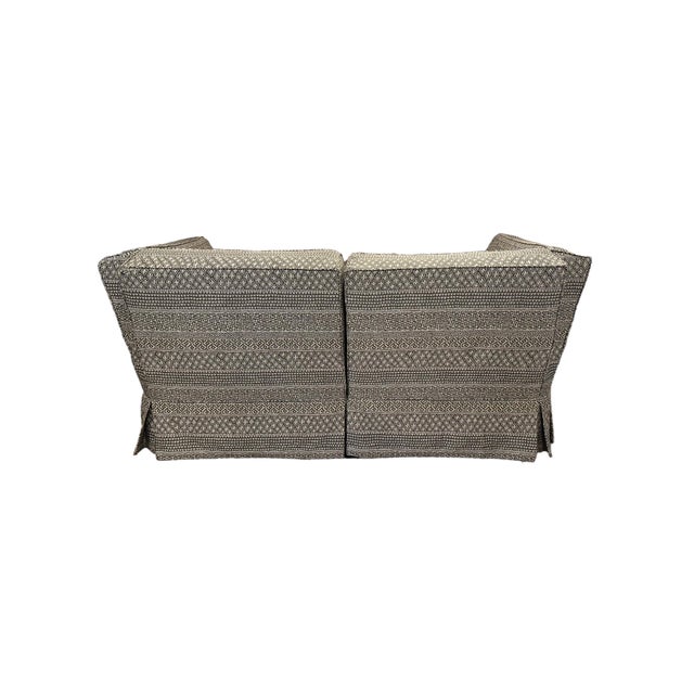 Two-piece loveseat or pair of chairs from Donghia's Saratoga Furniture Collection, upholstered in Donghia patterned fabric...