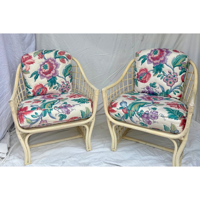 Bring classic coastal sophistication into your home with this stunning pair of vintage mid-century rattan barrel lounge...