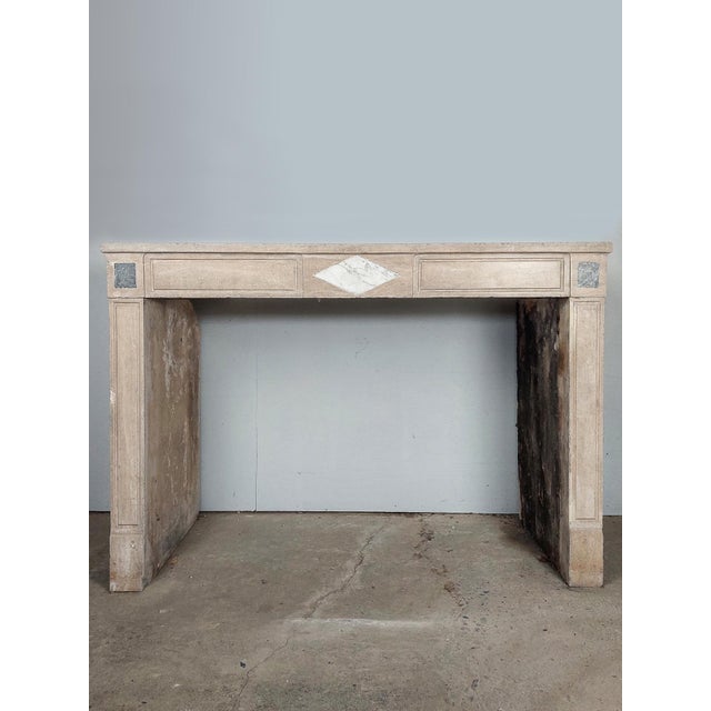 Antique French natural stone fireplace. 19th century mantelpiece made of burgundian stone (Pierre de bourgogne) in beige /...
