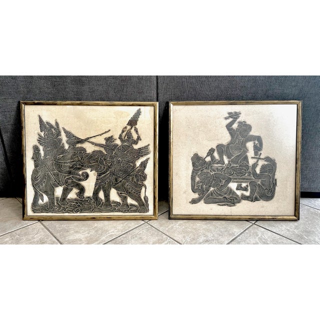 Pair vintage framed temple relief rubbings showcases exquisite Thai art from the mid-century era. Handmade in Thailand,...