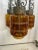 This nice Spanish gothic chandelier is in good shape with three swag portions with Amber caged light shades.The cages have...