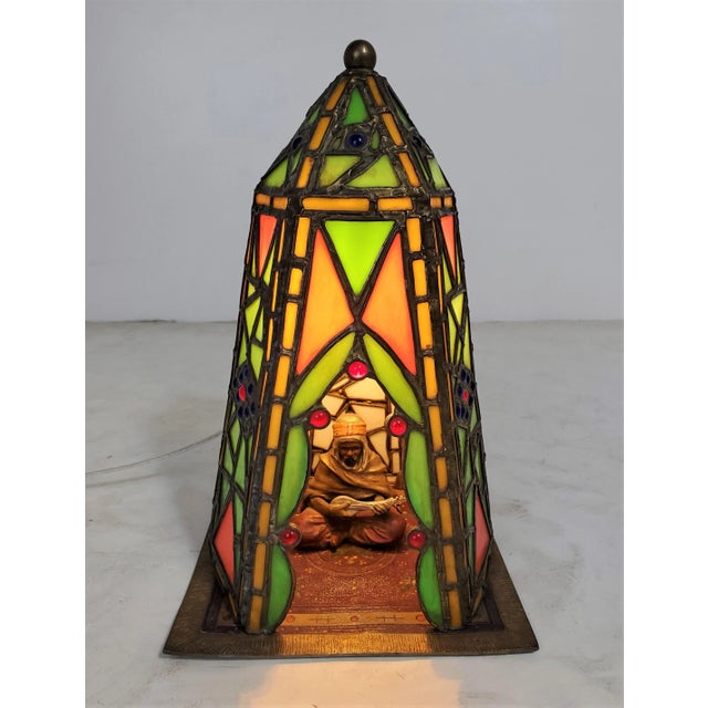 A charming Middle Eastern theme decorative table lamp / night light in leaded glass and cold painted French metal. Highly...