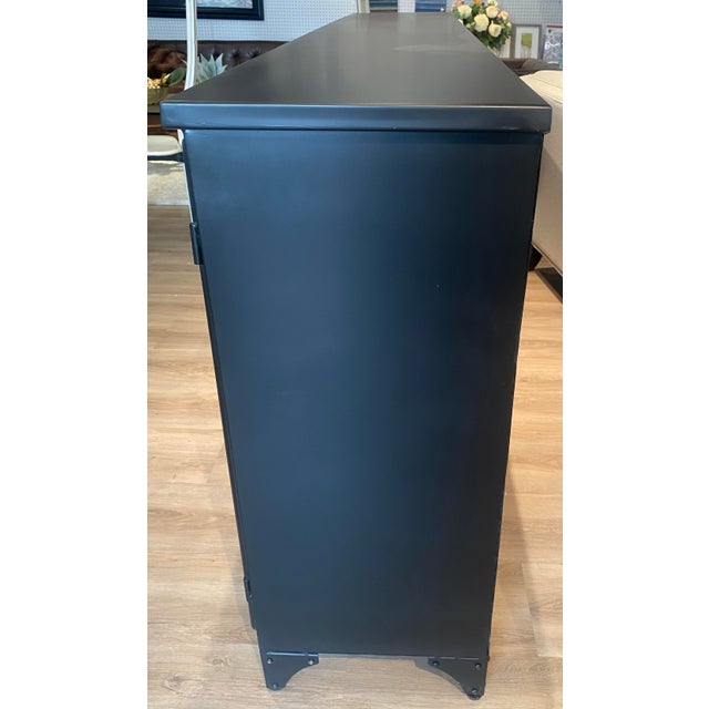 Description A distressed black iron frame contrasts a clean white interior for an updated take on the traditional media...