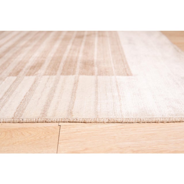 Rhea Quinn Brown Handmade Wool & Viscose Rug, Country of Origin: India. This exceptional piece showcases the mastery of...
